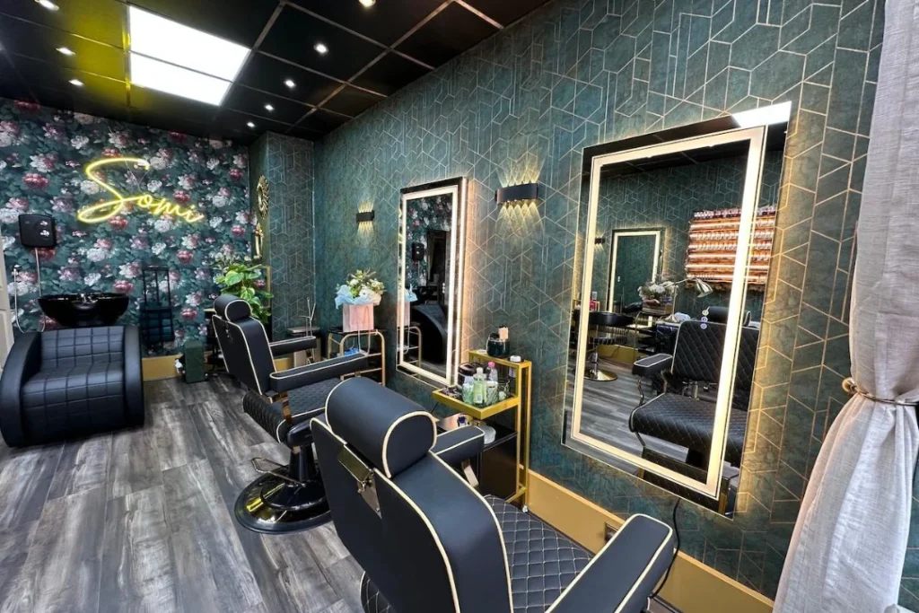 Modern salon website design with a luxurious interior, stylish barber chairs, and LED-lit mirrors.